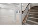 Unfinished basement with carpeted floor and staircase at 3481 Meadow Creek Pl, Highlands Ranch, CO 80126