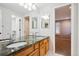 Double vanity bathroom with granite countertop at 3481 Meadow Creek Pl, Highlands Ranch, CO 80126