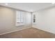 Bright bedroom with neutral walls and carpet at 3481 Meadow Creek Pl, Highlands Ranch, CO 80126