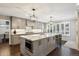 Modern kitchen with stainless steel appliances and marble countertops at 3481 Meadow Creek Pl, Highlands Ranch, CO 80126