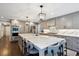 Renovated kitchen, featuring marble countertops and stainless steel appliances at 3481 Meadow Creek Pl, Highlands Ranch, CO 80126