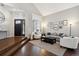 Living room with hardwood floors, neutral colors, and a cozy atmosphere at 3481 Meadow Creek Pl, Highlands Ranch, CO 80126