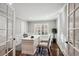 Bright home office with built-in shelving and hardwood floors at 3481 Meadow Creek Pl, Highlands Ranch, CO 80126