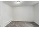 Basement bedroom has neutral colored walls and gray carpeting at 2056 Fulton St, Aurora, CO 80010
