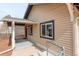 Charming home exterior featuring a covered porch and updated vinyl siding at 2056 Fulton St, Aurora, CO 80010