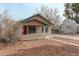 Cozy single-story house with a red front door, a small porch, and a well-maintained yard at 2056 Fulton St, Aurora, CO 80010