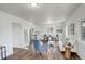 Open-concept living room with wood floors, bright white walls, and ample seating area at 2056 Fulton St, Aurora, CO 80010