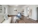 Spacious living room featuring wood floors, white walls, and an abundance of natural light at 2056 Fulton St, Aurora, CO 80010