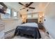 Bedroom featuring carpet floors, a ceiling fan, and a tufted headboard at 230 Miner St, Idaho Springs, CO 80452