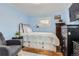 Bedroom with hardwood floors, accent wall, large window for plenty of natural light at 230 Miner St, Idaho Springs, CO 80452