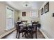 Cozy dining room featuring wood floors and a round dining table with seating for four at 230 Miner St, Idaho Springs, CO 80452