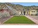 Charming yellow home with a well-manicured lawn and lovely curb appeal at 230 Miner St, Idaho Springs, CO 80452