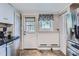 View of kitchen with stainless steel appliances and outdoor access at 230 Miner St, Idaho Springs, CO 80452