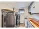 Modern laundry room with front load washer and dryer, butcher block countertop, and stylish cabinets at 230 Miner St, Idaho Springs, CO 80452