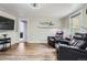 Inviting living room showcasing wood floors and comfortable recliners at 230 Miner St, Idaho Springs, CO 80452