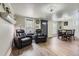 Open-concept living and dining area with wood floors and a view to the bathroom at 230 Miner St, Idaho Springs, CO 80452