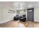 Warm living room with wood-look floors and cozy seating near the front door at 230 Miner St, Idaho Springs, CO 80452