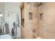 Tiled shower with built-in niche and storage at 1235 Dahlia St, Denver, CO 80220
