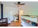 Bedroom featuring wood floors, built-in bunkbeds and a storage shelf at 1235 Dahlia St, Denver, CO 80220
