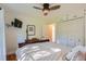 Comfortable bedroom with hardwood floors, ceiling fan, and closet at 1235 Dahlia St, Denver, CO 80220