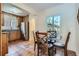 Eat-in kitchen features a dining table with seating near the window at 1235 Dahlia St, Denver, CO 80220