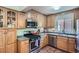 Efficient kitchen featuring stainless steel appliances, ample cabinet space, and a cozy, inviting atmosphere at 1235 Dahlia St, Denver, CO 80220