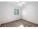 Bright bedroom featuring carpet, a ceiling fan, and a window for natural light at 12977 W Dorado Pl, Littleton, CO 80127
