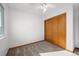 Bedroom featuring sliding closet doors, carpet, a ceiling fan, and a window at 12977 W Dorado Pl, Littleton, CO 80127