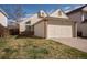 Charming home featuring a two-car garage and well-maintained lawn, perfect for suburban living at 12977 W Dorado Pl, Littleton, CO 80127