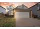 Inviting home boasts an attached two-car garage and a well-manicured lawn at 12977 W Dorado Pl, Littleton, CO 80127