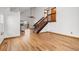 Open living area with hardwood floors, stairs, and lots of natural light at 12977 W Dorado Pl, Littleton, CO 80127