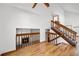 Open floorplan with a wooden staircase and a ceiling fan at 12977 W Dorado Pl, Littleton, CO 80127