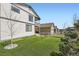 Manicured backyard featuring green artificial turf and views of the neighboring houses at 1994 Spencer Ave, Castle Rock, CO 80104