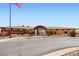 Stunning building facade under a bright blue sky with a flag blowing in the wind at 1994 Spencer Ave, Castle Rock, CO 80104