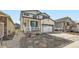 Charming two-story home with a front porch, attached garage, and well-maintained landscaping at 1994 Spencer Ave, Castle Rock, CO 80104