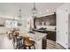 Modern kitchen featuring granite countertops, stainless steel appliances, and a center island with seating at 1994 Spencer Ave, Castle Rock, CO 80104