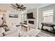 Bright living room boasts modern ceiling fan, fireplace, and stylish decor at 1994 Spencer Ave, Castle Rock, CO 80104