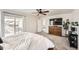 Spacious main bedroom with access to a private balcony, complemented by a ceiling fan and modern furnishings at 1994 Spencer Ave, Castle Rock, CO 80104