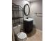 This bathroom offers a vanity with storage and a modern mirror at 5612 S Lansing Ct, Englewood, CO 80111