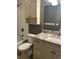 This bathroom features an extended vanity with granite countertops and storage at 5612 S Lansing Ct, Englewood, CO 80111