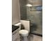 This bathroom offers a tiled shower with glass door and modern fixtures at 5612 S Lansing Ct, Englewood, CO 80111