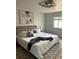Bright bedroom with a queen-sized bed, stylish decor, and large windows at 5612 S Lansing Ct, Englewood, CO 80111