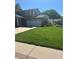 Well maintained two story home, with a beautiful lawn, driveway, and attached two car garage at 5612 S Lansing Ct, Englewood, CO 80111