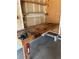 Garage featuring a custom work bench ready for projects, with pegboard storage and room to tinker at 5612 S Lansing Ct, Englewood, CO 80111
