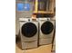 Laundry room featuring stacked Samsung washer and dryer at 5612 S Lansing Ct, Englewood, CO 80111