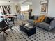 Bright living room with open kitchen view featuring modern furniture and stylish decor at 5612 S Lansing Ct, Englewood, CO 80111