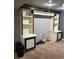 Living room with built in shelving, cabinets, and wiring for speakers at 5612 S Lansing Ct, Englewood, CO 80111