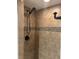 Shower features tiled walls and modern fixtures at 5612 S Lansing Ct, Englewood, CO 80111