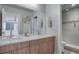 Double vanity bathroom with plenty of counter space, tile floors, and updated fixtures at 1921 Hooker St, Denver, CO 80204