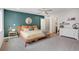 Cozy bedroom with a modern bed frame, plush carpet, and a view into the ensuite bathroom at 1921 Hooker St, Denver, CO 80204